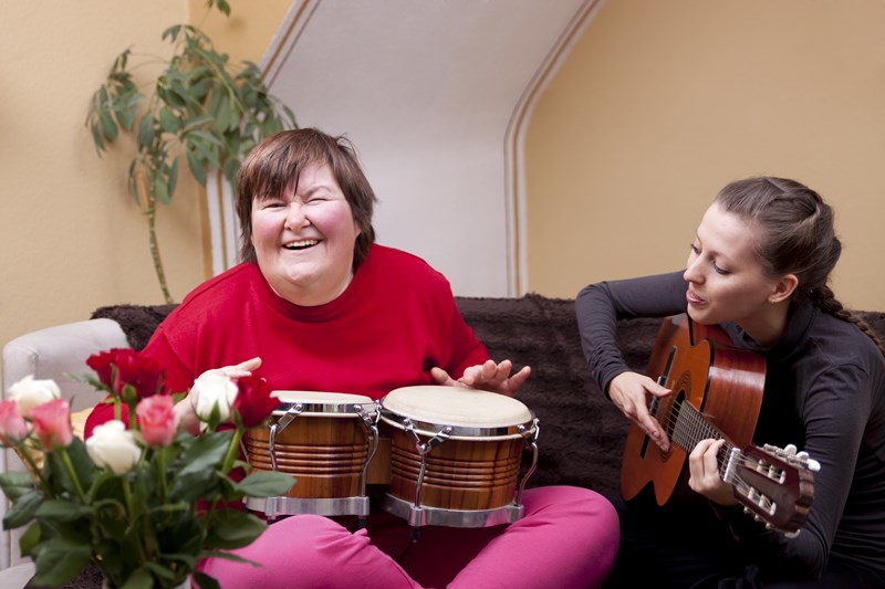 Women Playing Bongos and Guitar