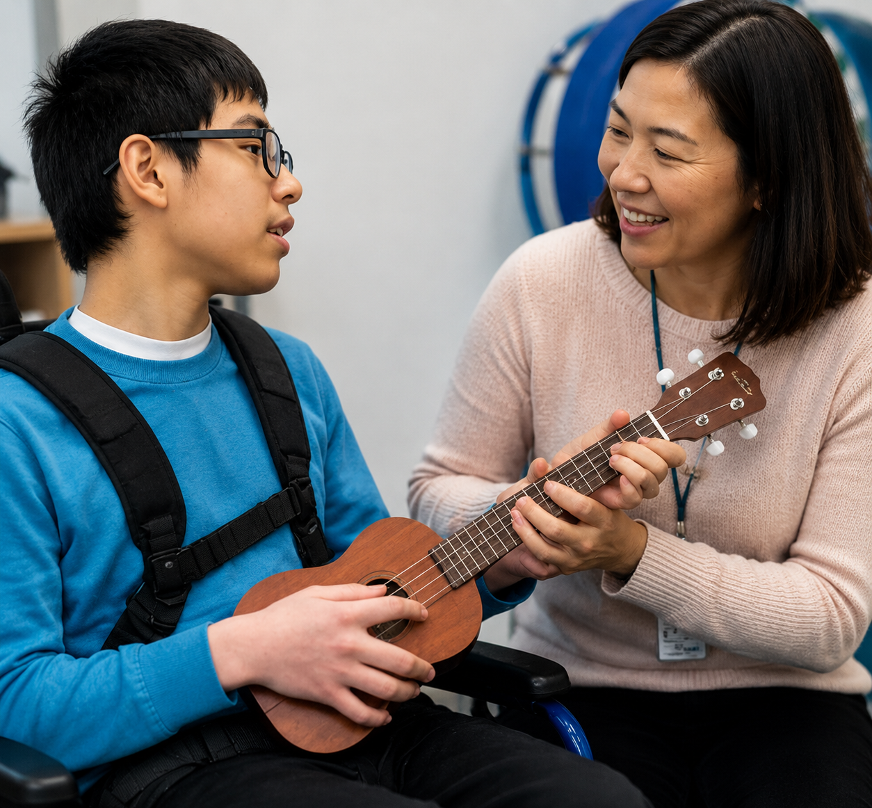 board-certified-music-therapist-supporting-teen-with-disability-during-ukulele-music-therapy-session