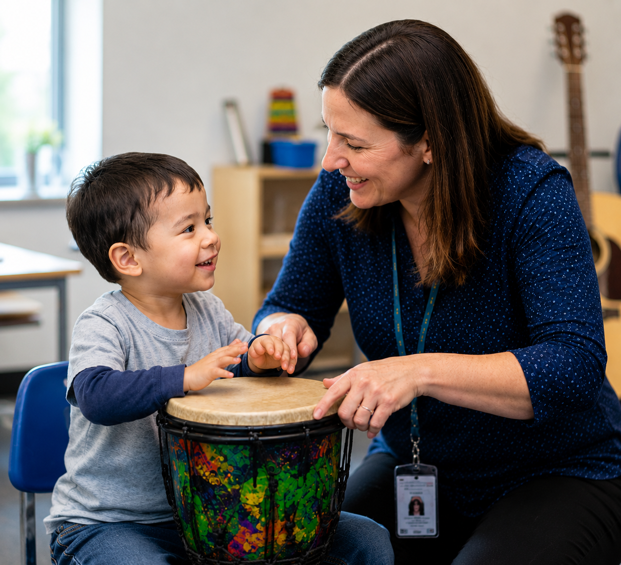 board-certified-music-therapist-using-hand-drum-with-young-child-during-music-therapy-session