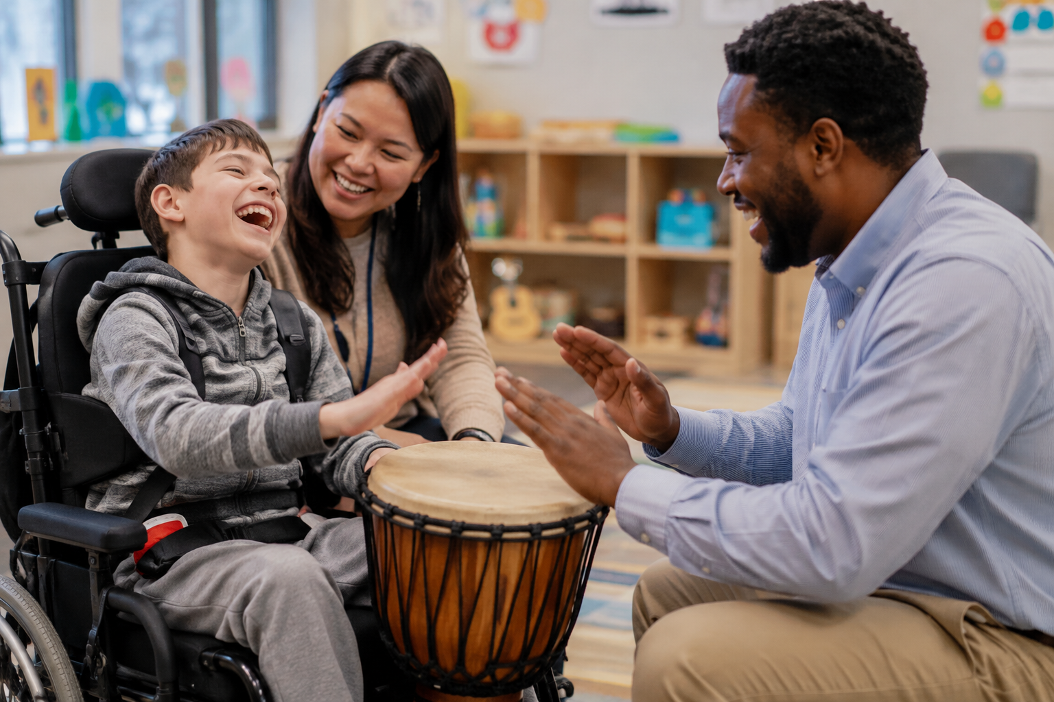 inclusive-music-therapy-student-wheelchair-diverse-teachers-drum-session